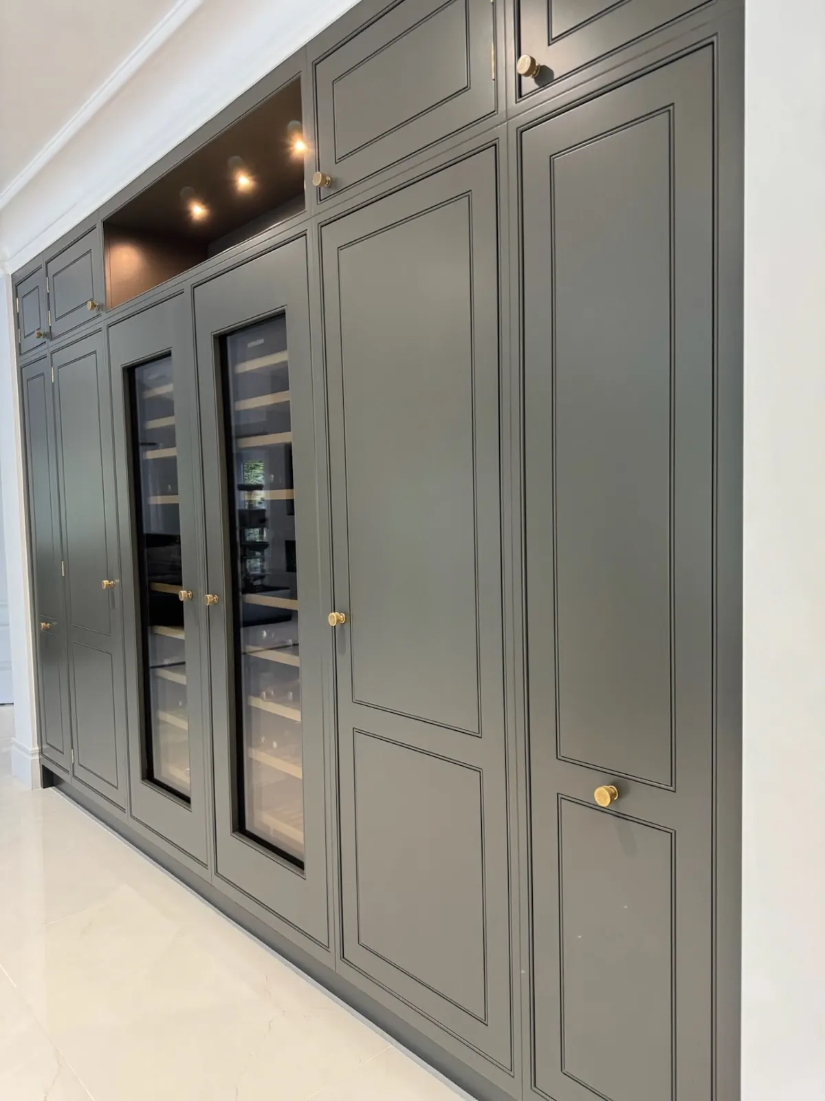 After: tall cabinetry wall