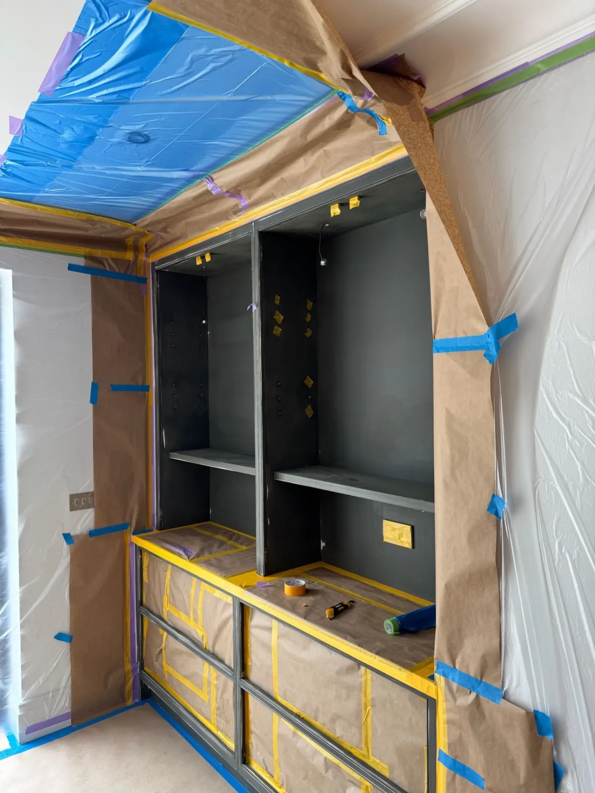 Before: tall cabinetry wall